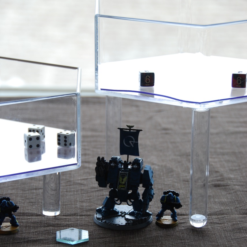 Over 5 inches tall with the long legs! two Dice Shields over miniatures on a table. The left
Dice Shield has short legs and the Dice Shield on the right has long legs.